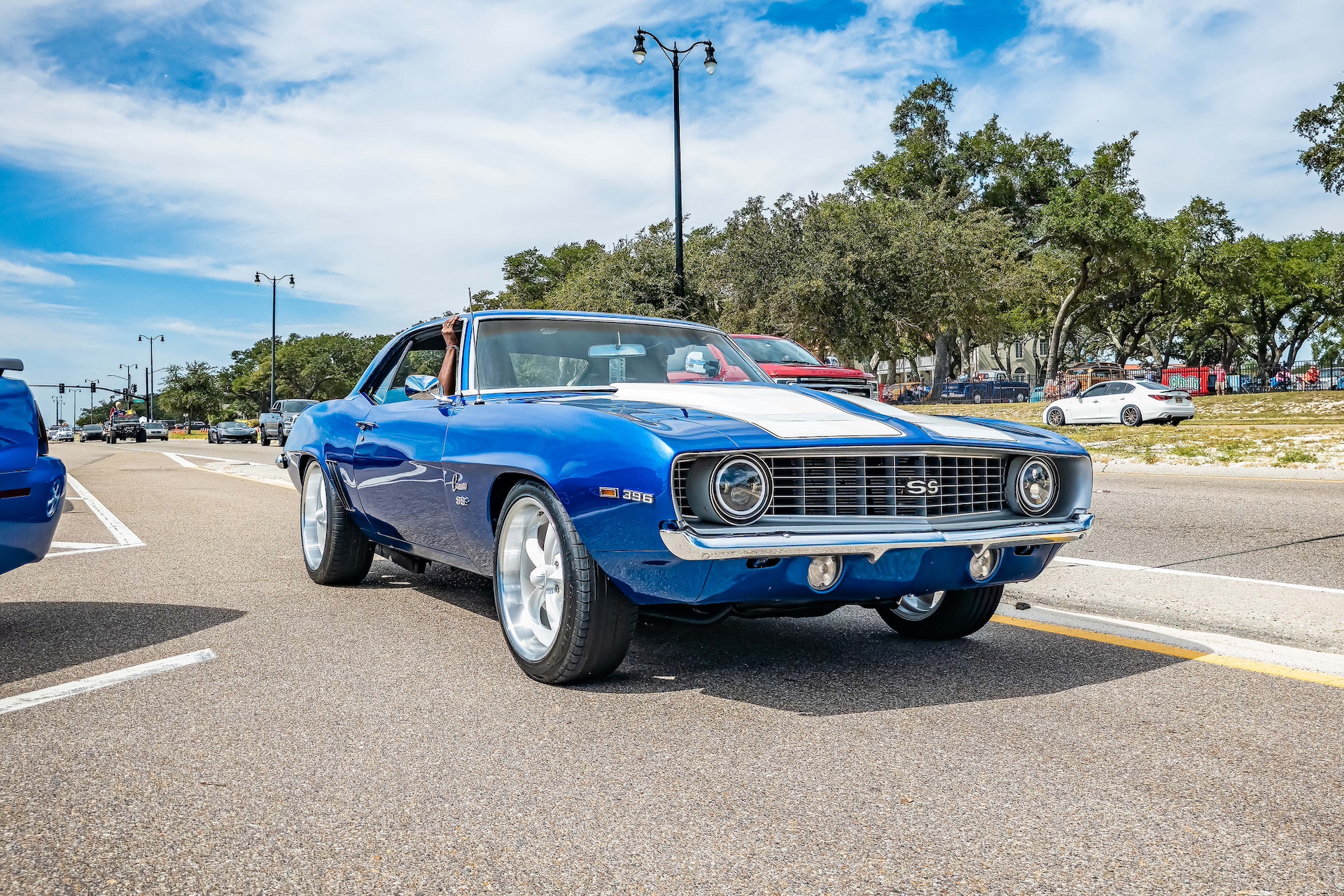 Low perspective front corner view of a 1969 Chevrolet Camaro SS Coupe of a at a local car show.
